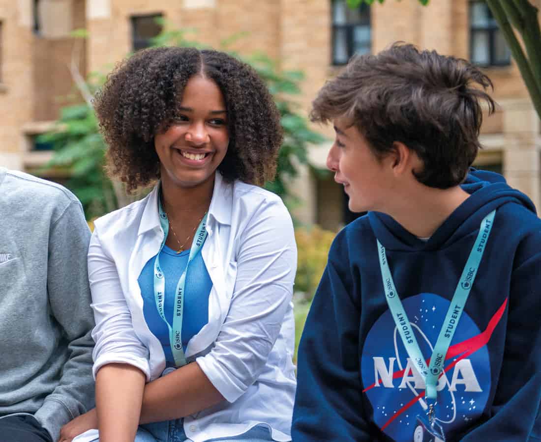 Smiling female student with two other students at Oxford College 澳洲五号码结果 Summer Boarding Courses